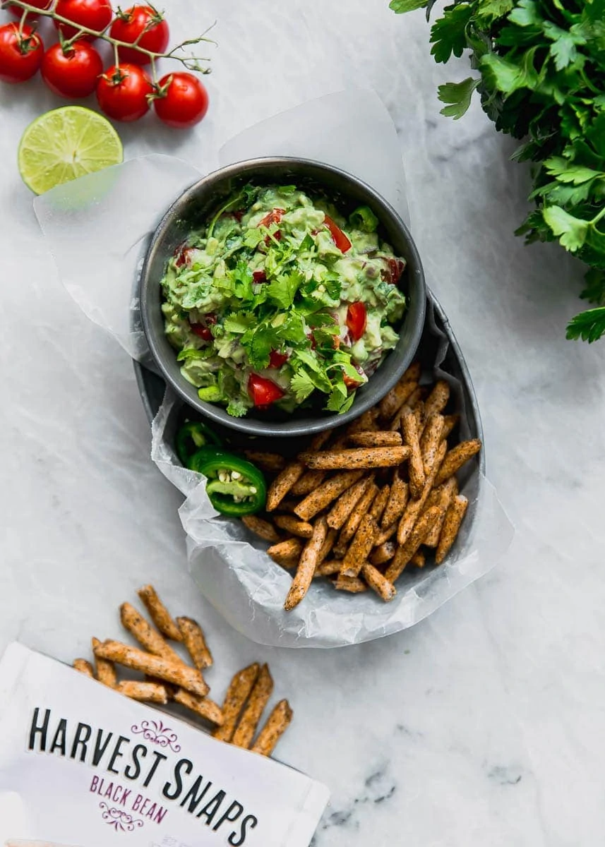 Secret ingredient alert! This Ultimate Skinny Guacamole is lighter and healthier, yet just as creamy and delicious. You'll never eat "regular" guac again!