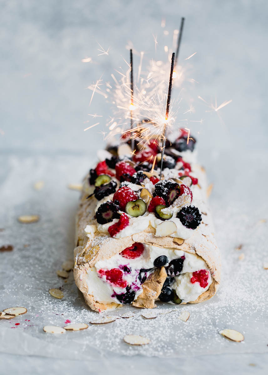 A Triple Berry Meringue Roulade perfect for summer nights. Easy to make and a total crowd-pleaser!