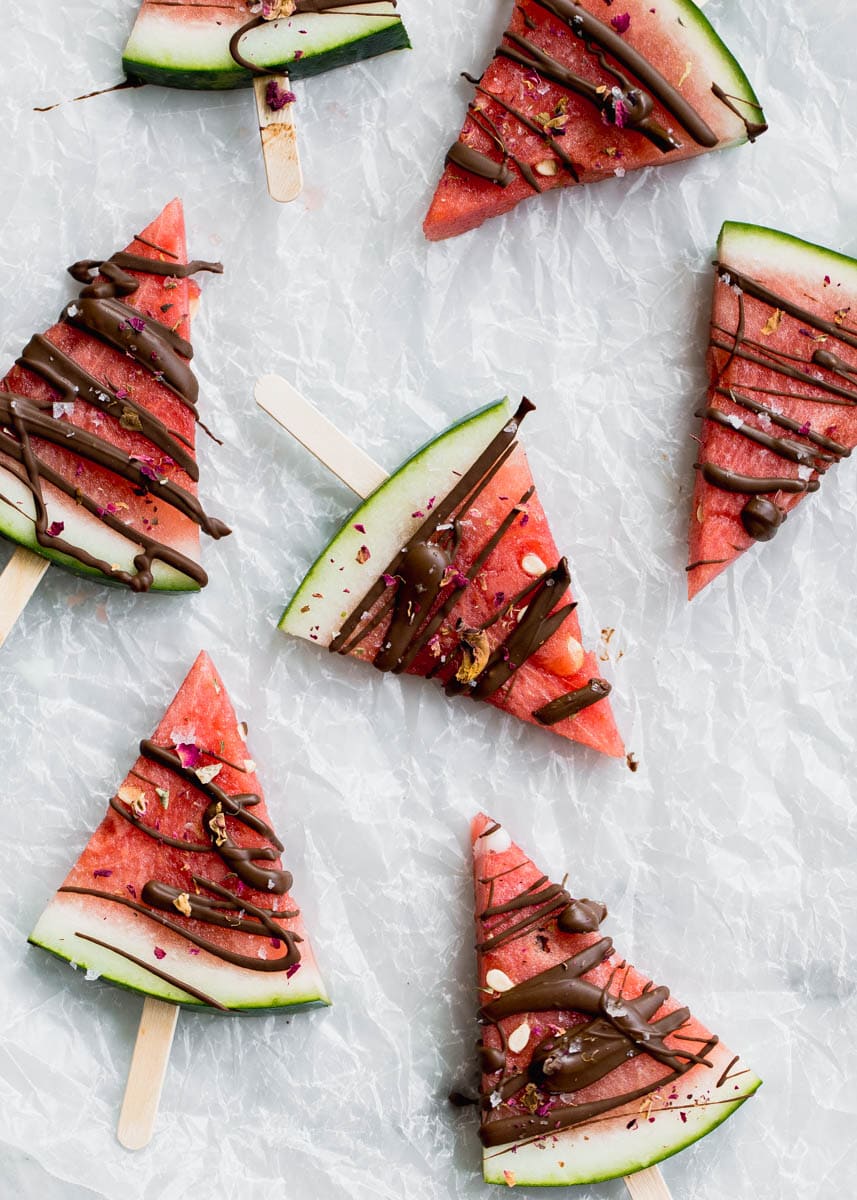 Low in sugar and totally refreshing, these fresh watermelon popsicles drizzled with chocolate and sea salt are the perfect treat on a hot summer's day! 