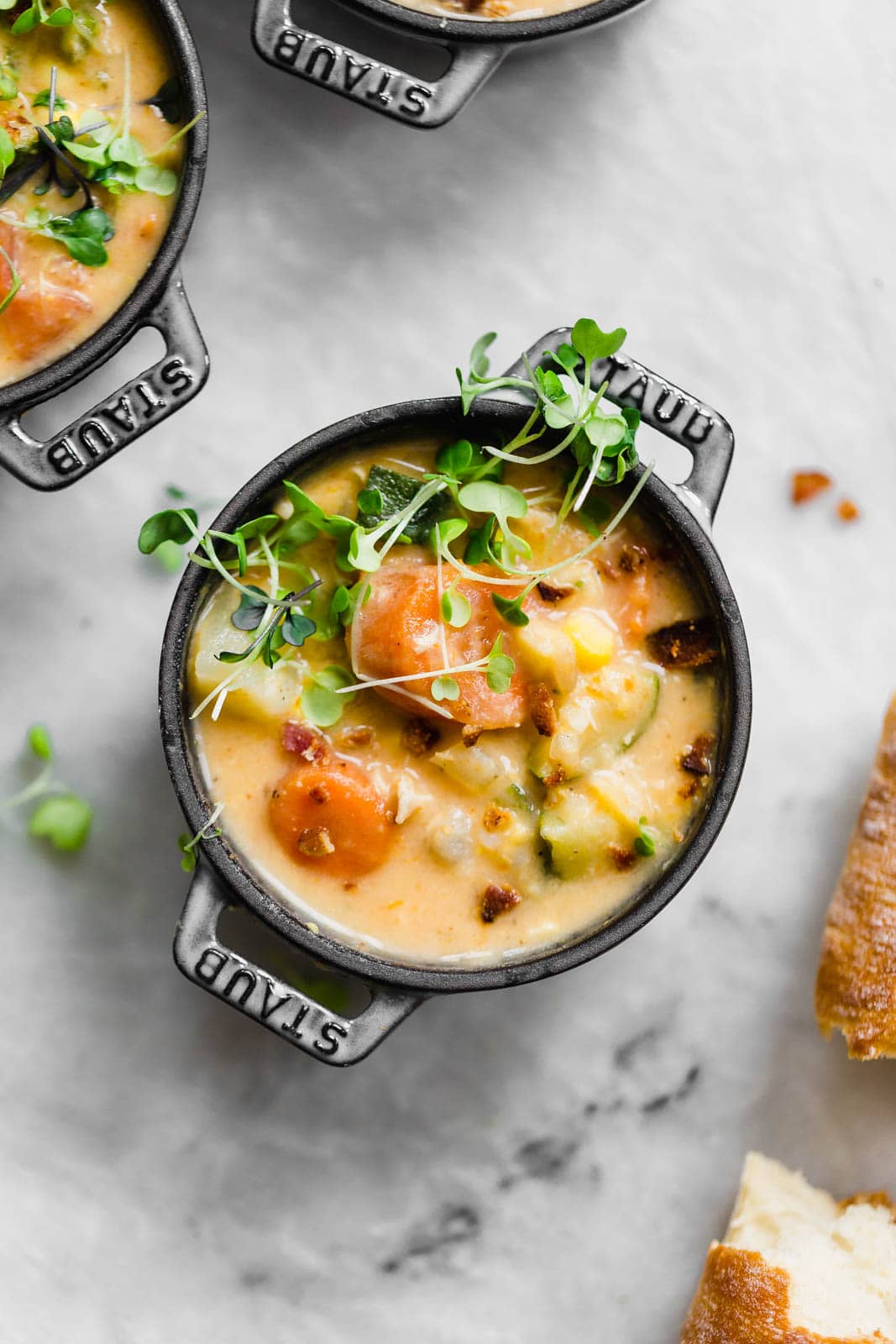 chicken corn chowder topped with microgreens 