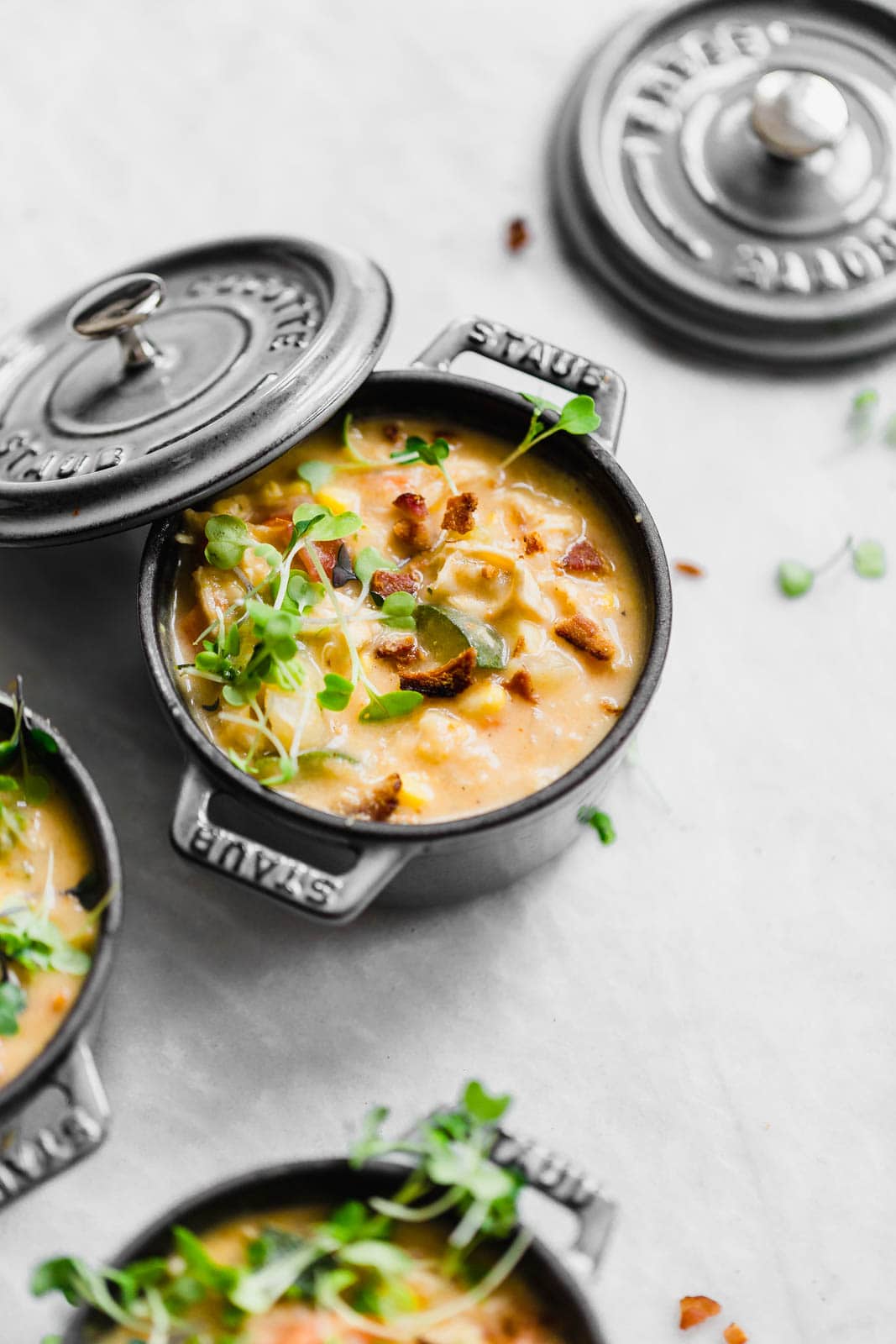 chicken corn chowder topped with microgreens and bacon bits