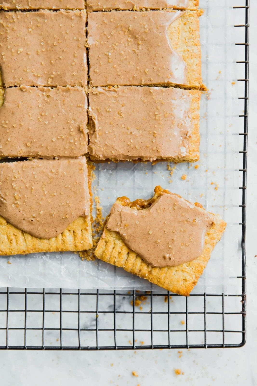 A giant buttery, flakey Grain Free Pumpkin Pop-Tart with a fall-spiced pumpkin filling and topped with a cinnamon maple glaze!