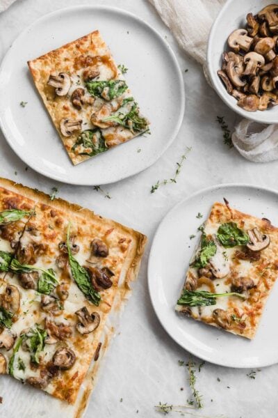 A thin crust Caramelized Onion Mushroom and Spinach Pizza perfect for those weeknights when you want a quick fix dinner!
