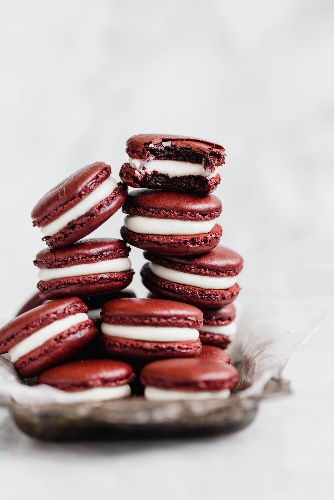 Decadent Red Velvet Macarons with a cream cheese frosting. Perfect for the holiday season, or just because!