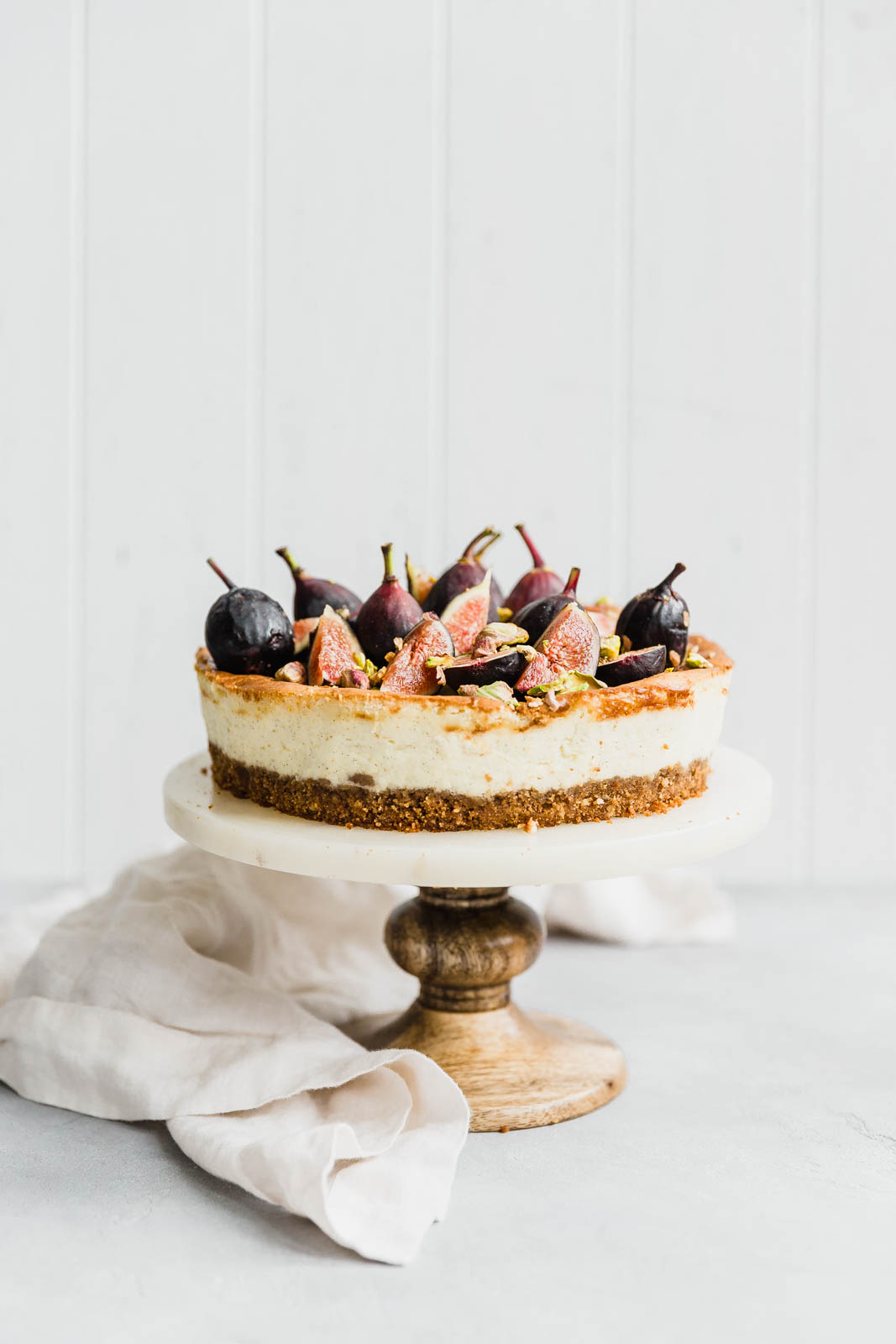 Vanilla bean cheesecake on a cake stand