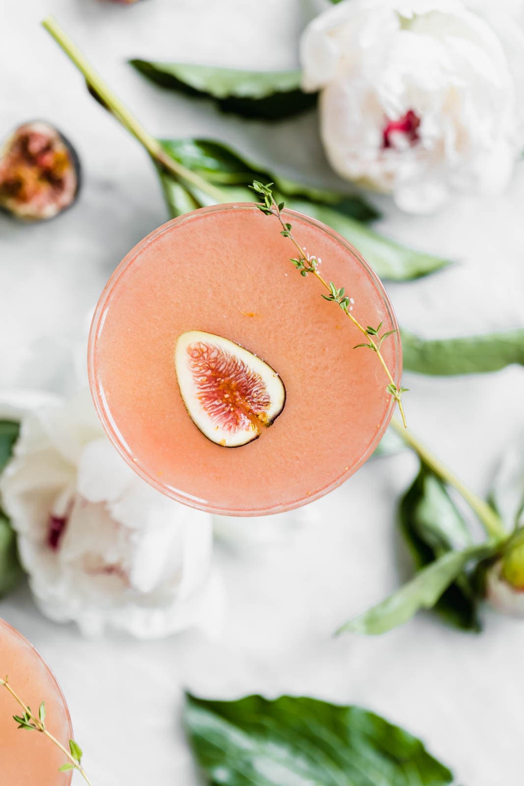 It's about figgin thyme for a cocktail! This fig and thyme cocktail is festive, bright, and perfect for your next get together! 