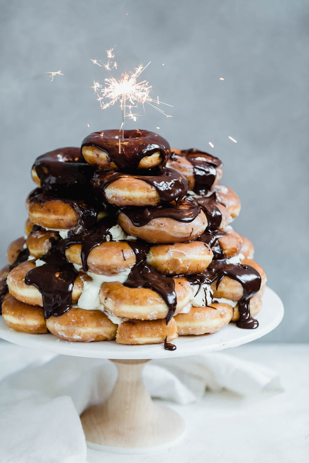 Krispy Kreme Doughnut Cake: a cake made entirely of Krispy Kreme doughnuts and drizzled with chocolate fudge sauce. I’ve died and gone to heaven.
