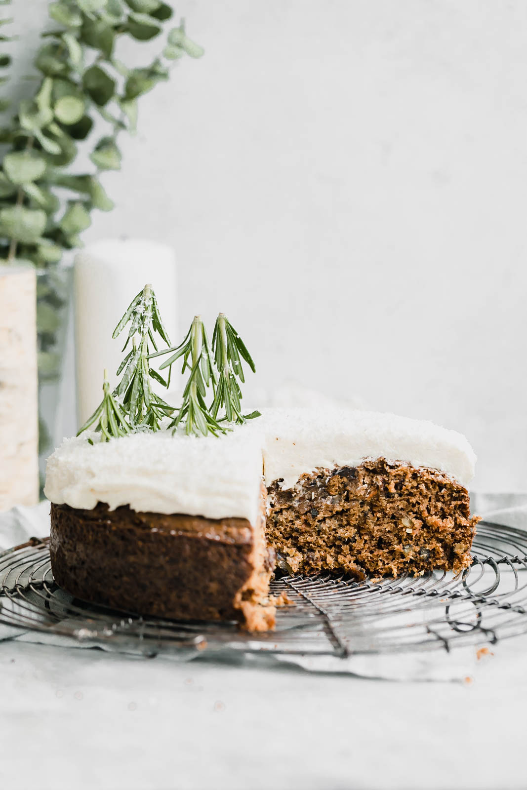 coconut carrot cake with cream cheese frosting on wire rack