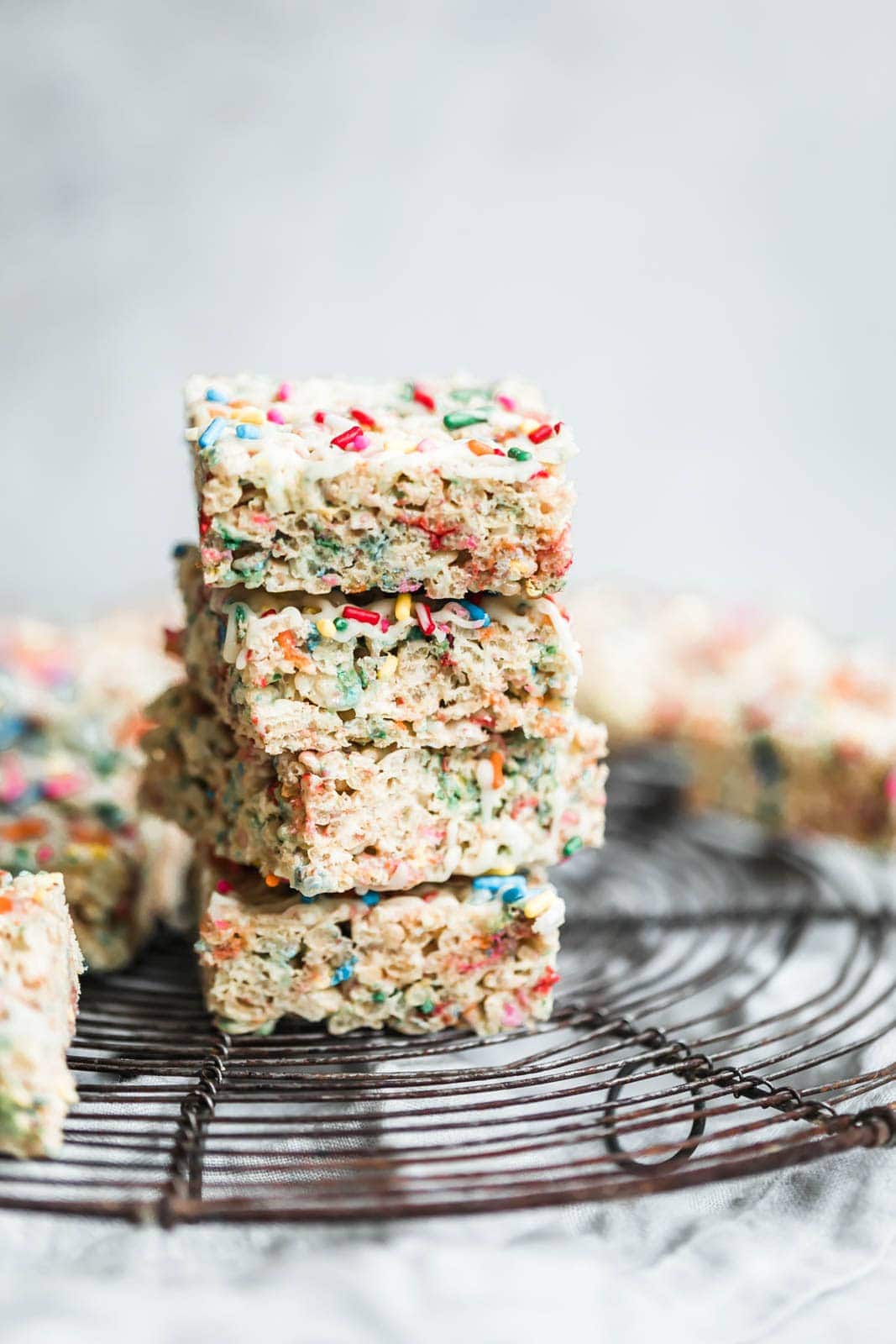 The easiest, prettiest White Chocolate Funfetti Rice Krispie Treats ever! Made with only 5 ingredients, these babies come together in just minutes!