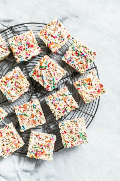 The easiest, prettiest White Chocolate Funfetti Rice Krispie Treats ever! Made with only 5 ingredients, these babies come together in just minutes!