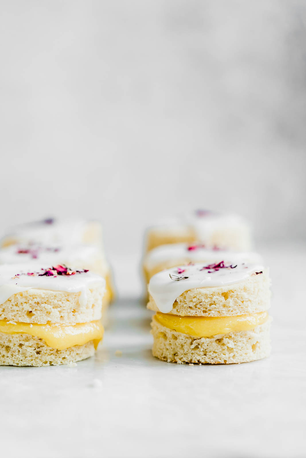 Coconut Lemon Curd Petit Fours: homemade lemon curd sandwiched between two coconut flour cakes and topped with lemon icing. HELLO SPRING!