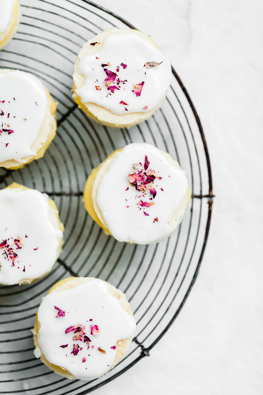 Coconut Lemon Curd Petit Fours: homemade lemon curd sandwiched between two coconut flour cakes and topped with lemon icing. HELLO SPRING!