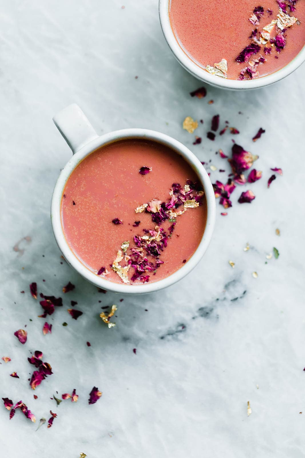 Elevate your bedtime routine with this Pink Moon Milk fit for a princess. Made with vanilla almondmilk, beetroot, turmeric, agave, dried rose hips, and edible gold.