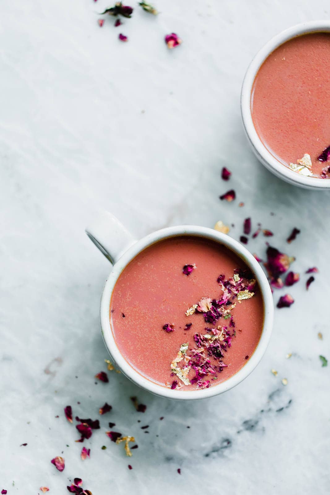 Elevate your bedtime routine with this Pink Moon Milk fit for a princess. Made with vanilla almondmilk, beetroot, turmeric, agave, dried rose hips, and edible gold.