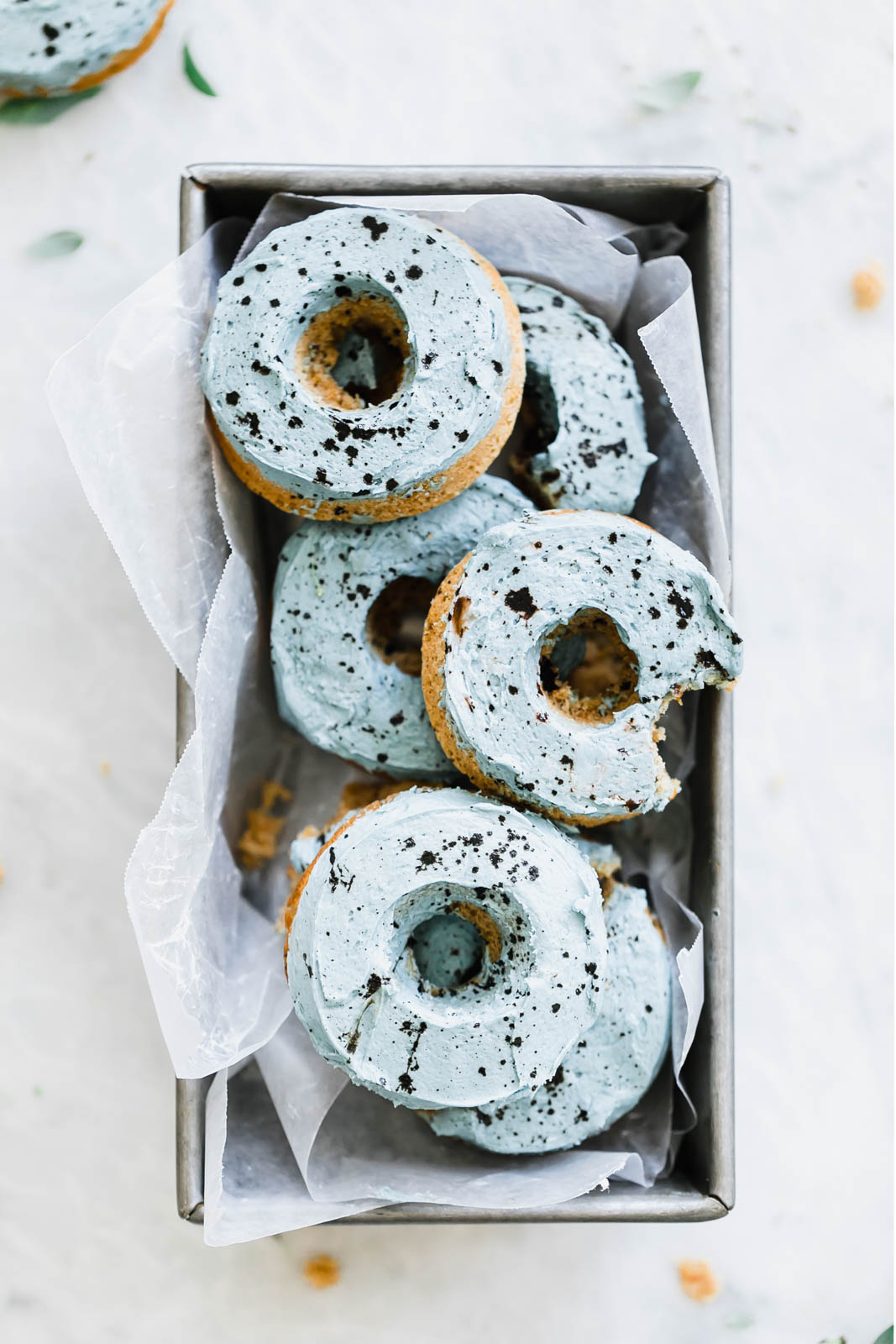 carrot cake donuts with light blue frosting