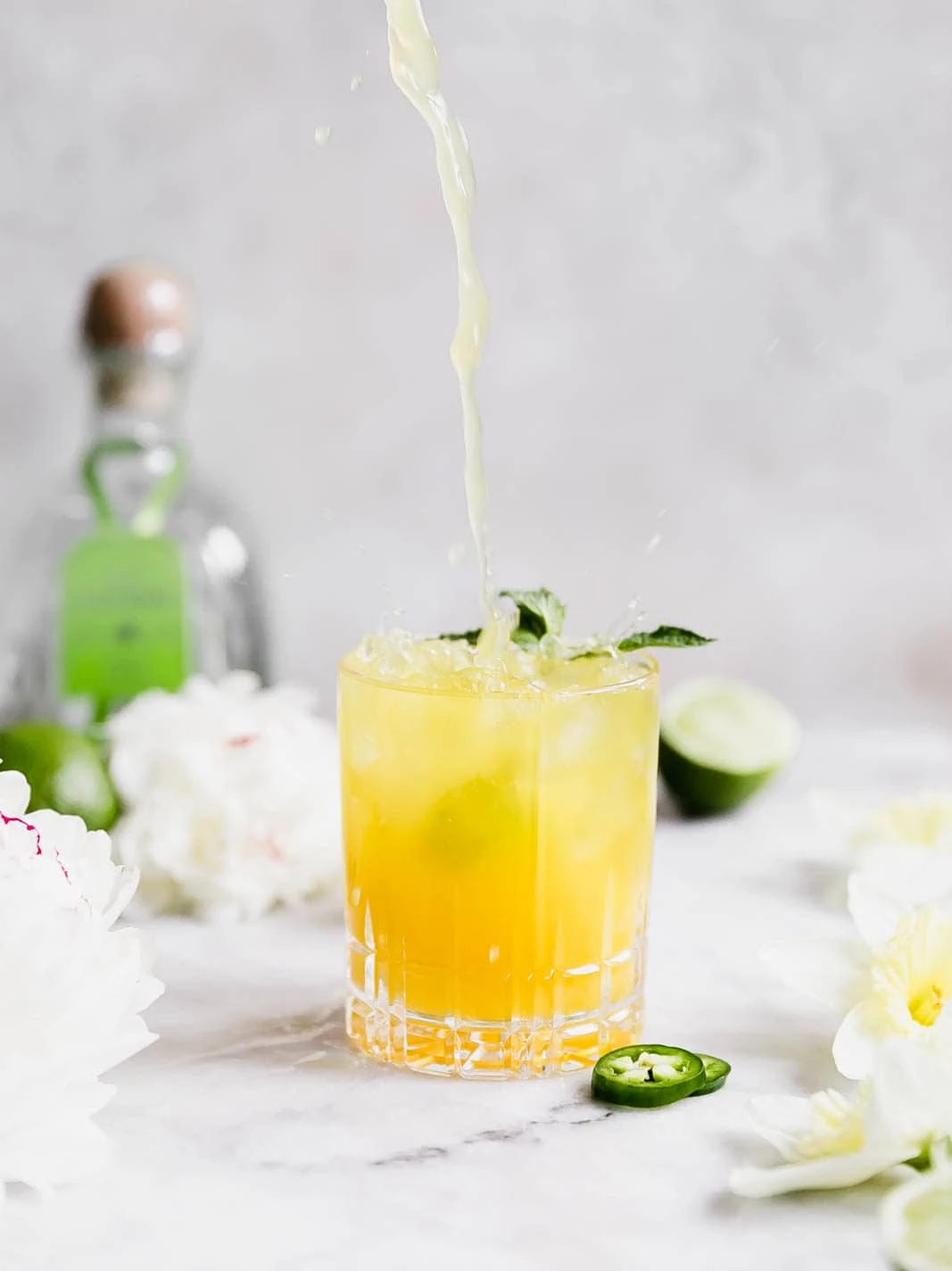 A ridiculously refreshing Spicy Passionfruit Margarita made with a homemade spicy passionfruit syrup, orange liqueur, and tequila