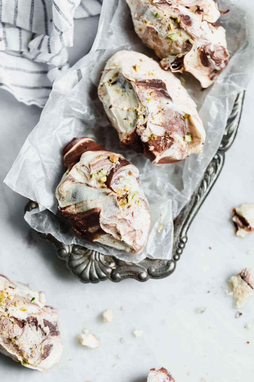 The easiest chocolate swirled spoon meringues that you literally spoon onto a baking sheet. Top 'em with crumbled pistachios, bake, and done!