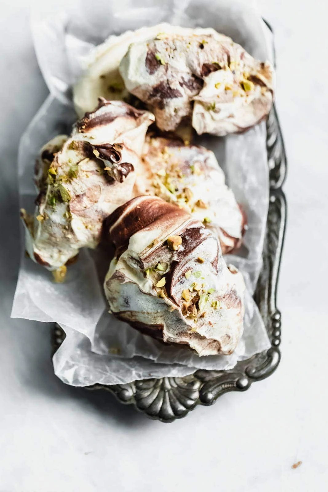 The easiest chocolate swirled spoon meringues that you literally spoon onto a baking sheet. Top 'em with crumbled pistachios, bake, and done!