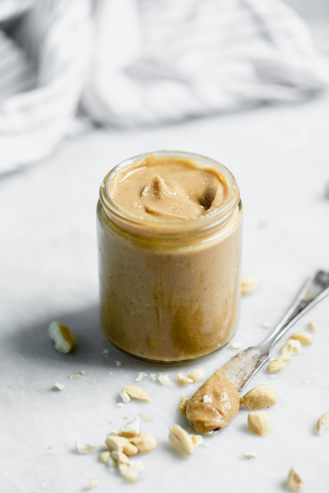 Vanilla Cardamom Cashew Butter in jar with knife