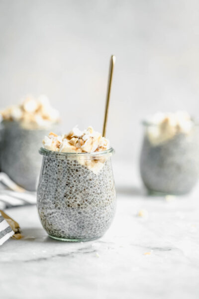 Perfect for weekday breakfast, this thick vegan Coconut Cream Pie Chia Pudding is made with almond milk and topped with banana, coconut flakes, and cashews