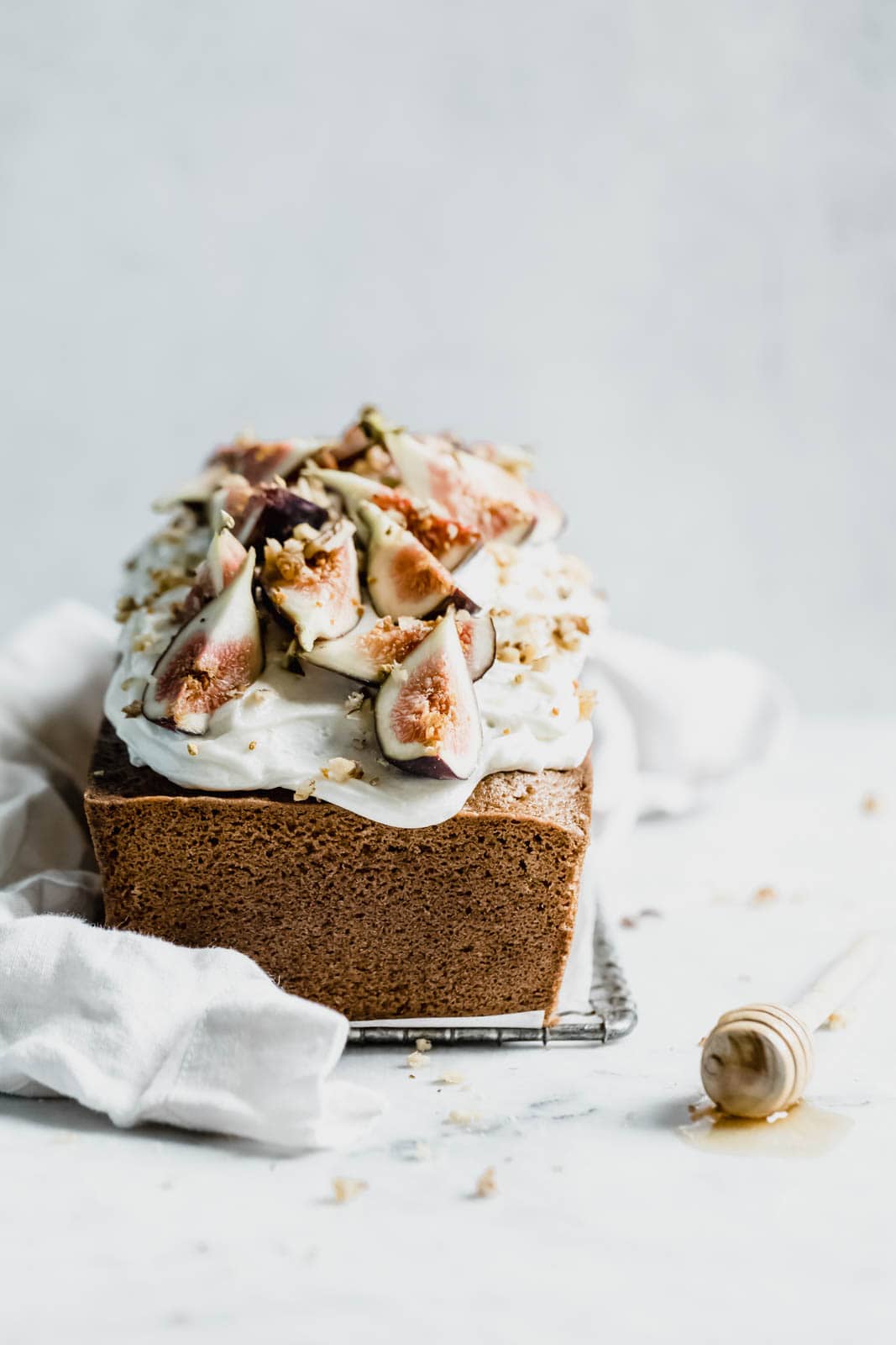 A beautifully simple one bowl honey cake spiced with cinnamon, orange, and black tea, and topped with fresh figs and a goat cheese frosting!