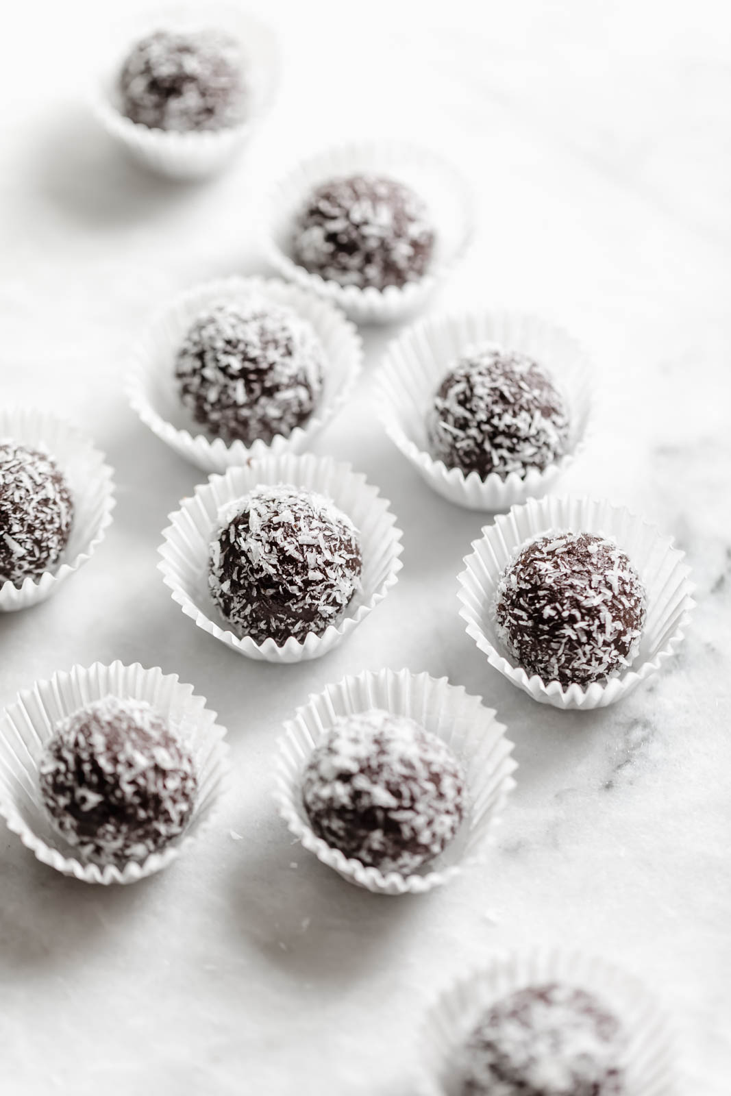 chocolate date balls rolled in coconut