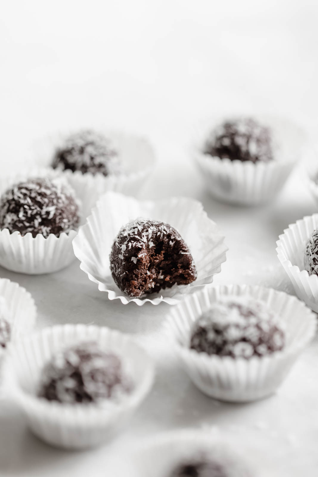 chocolate date balls in paper wrappers