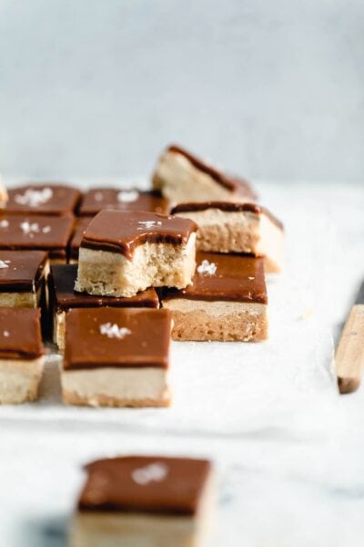 A buttery shortbread topped with a halva "nougat" and tahini caramel, this Middle Eastern Millionaire's Shortbread is sinfully delicious!