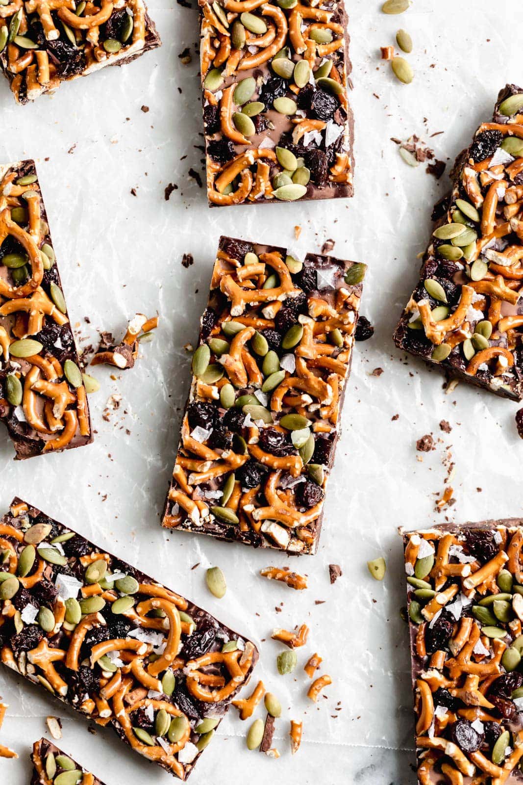 slices of Dark Chocolate Bark with Pumpkin Seeds, Pretzels, and Dried Fruit