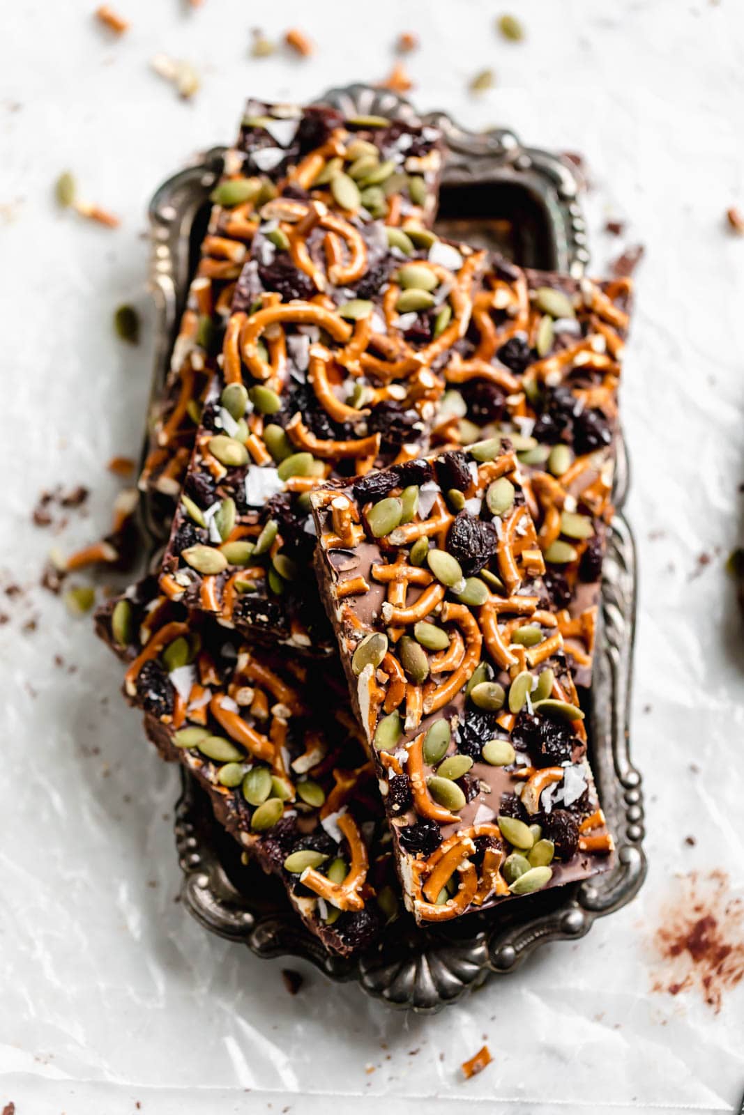 Dark Chocolate Bark with Pumpkin Seeds, Pretzels, and Dried Fruit on a tray