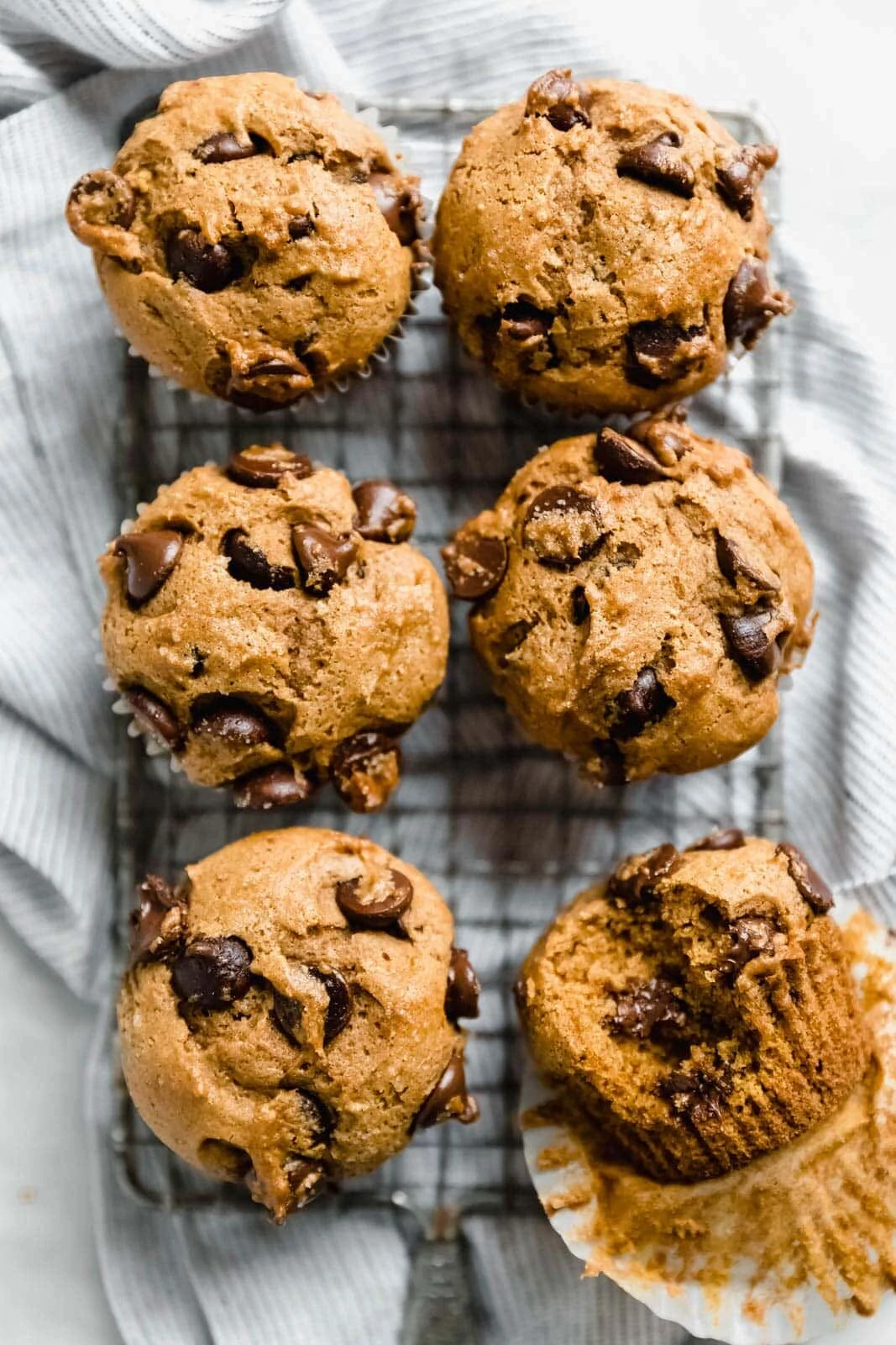 Absurdly moist Pumpkin Chocolate Chip Muffins made with cinnamon, nutmeg, ginger, and giant chocolate chips! Bonus: freeze them for an easy weekday treat!