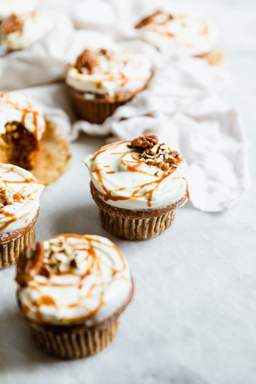 The perfect winter cupcake is here! Sweet potato cupcakes flavored with cinnamon and ginger and topped with a tangy cream cheese frosting.