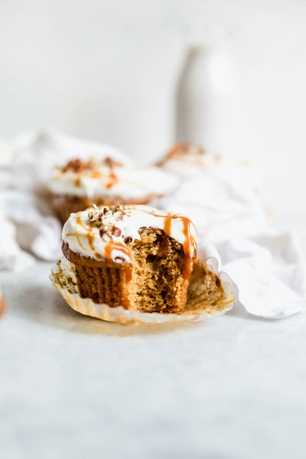The perfect winter cupcake is here! Sweet potato cupcakes flavored with cinnamon and ginger and topped with a tangy cream cheese frosting.
