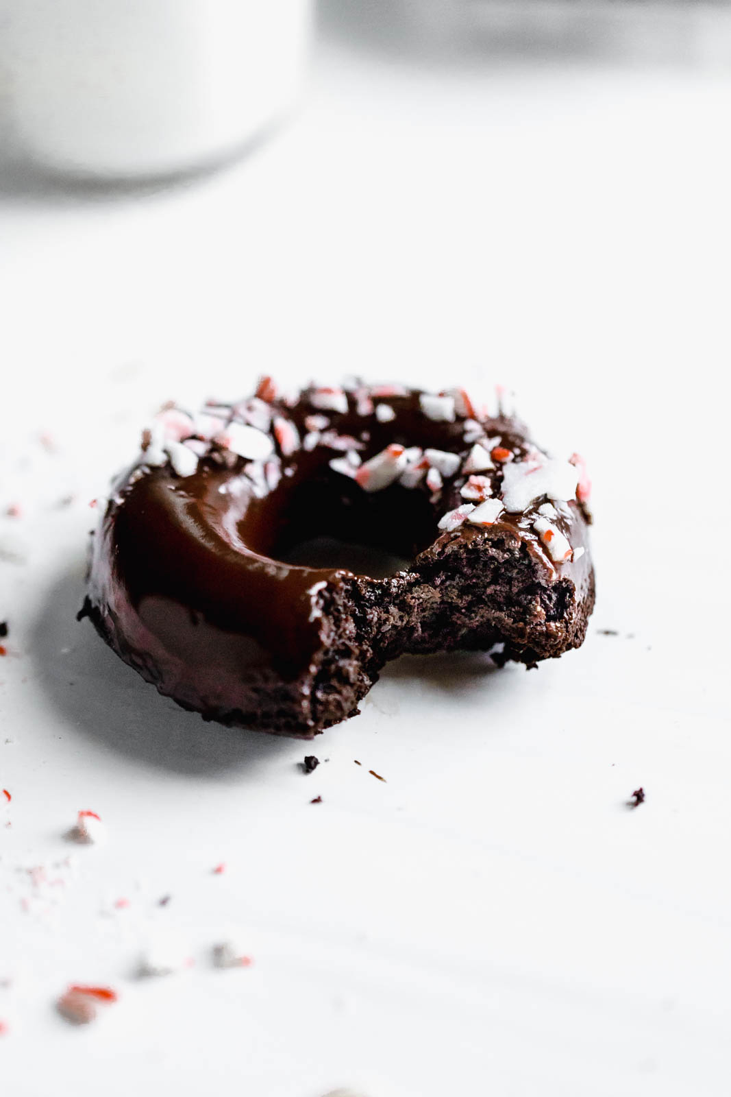 Ultra moist dairy-free and grain-free baked Peppermint Chocolate Donuts made topped with a dark chocolate ganache and candied peppermints. NOM.