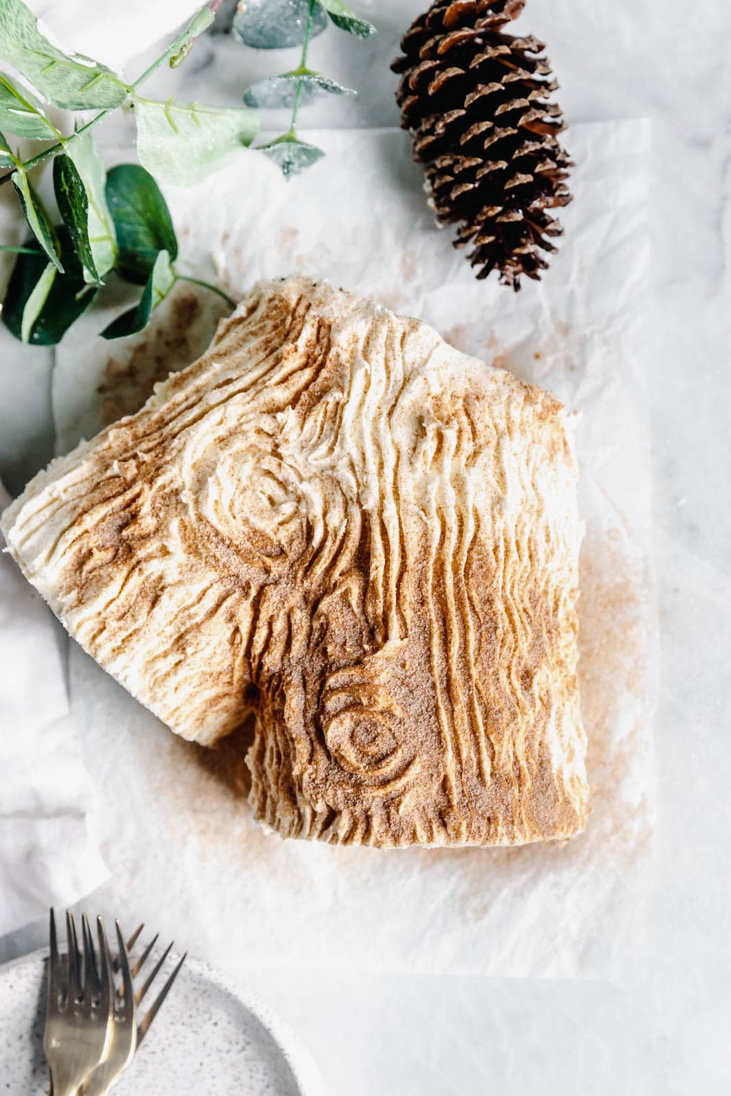 This festive White Chocolate Gingerbread Yule Log is a showstopper Christmas dessert. Made with white chocolate buttercream "bark" for that rustic look!