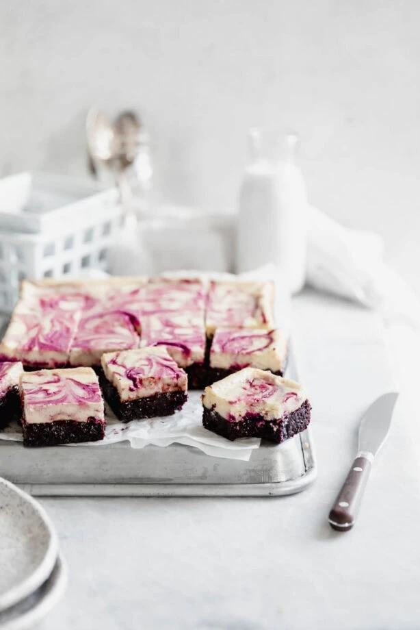 Black Cherry Cheesecake Brownies so rich and delicious you won't be able to stop at just one! Made with a black cherry swirl and fudgy brownie bottom.
