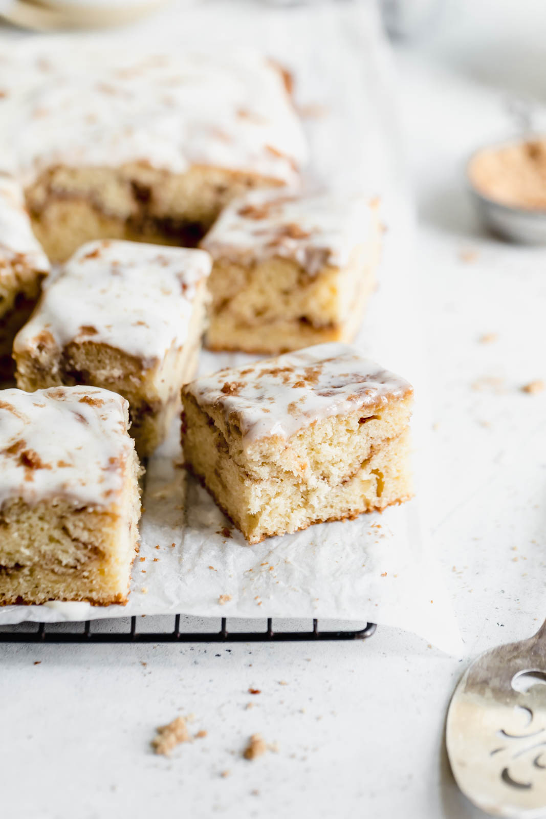 Buttery cinnamon roll cake swirled with ribbons of cinnamon and topped with a cream cheese glaze. All the decadence of a Cinnabon in half the time.