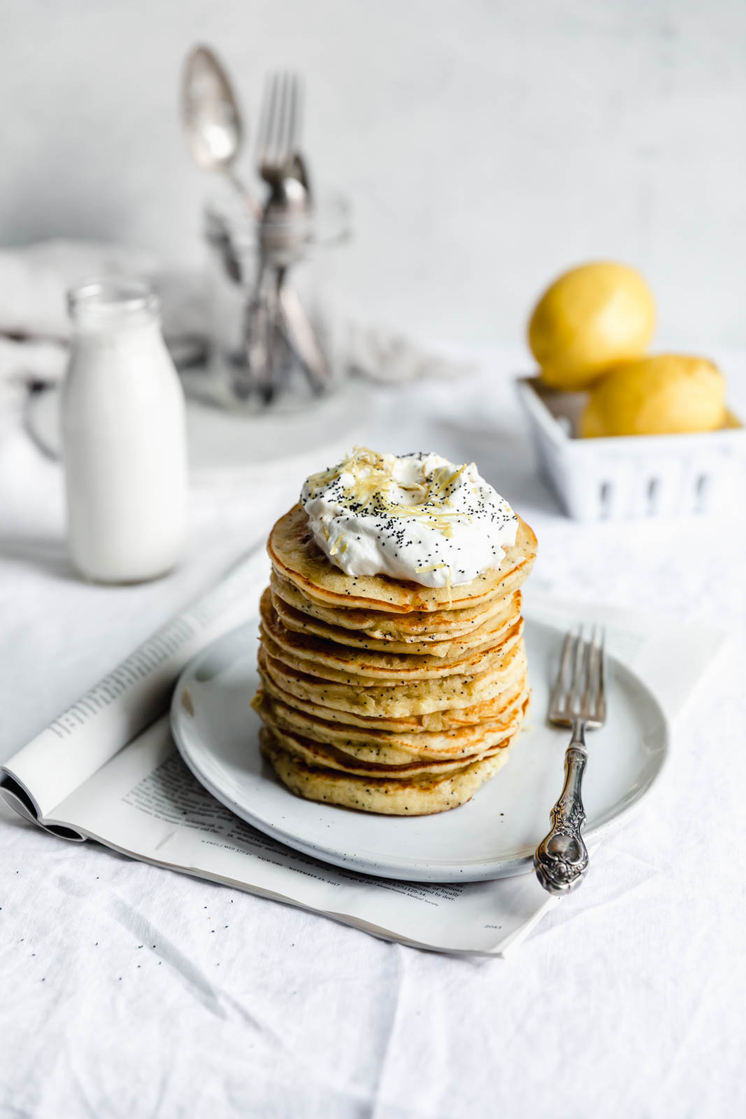 Light and fluffy Gluten Free Lemon Poppy Seed Pancakes made with almond flour and lemon zest. But proceed with caution: you might eat the whole batch!