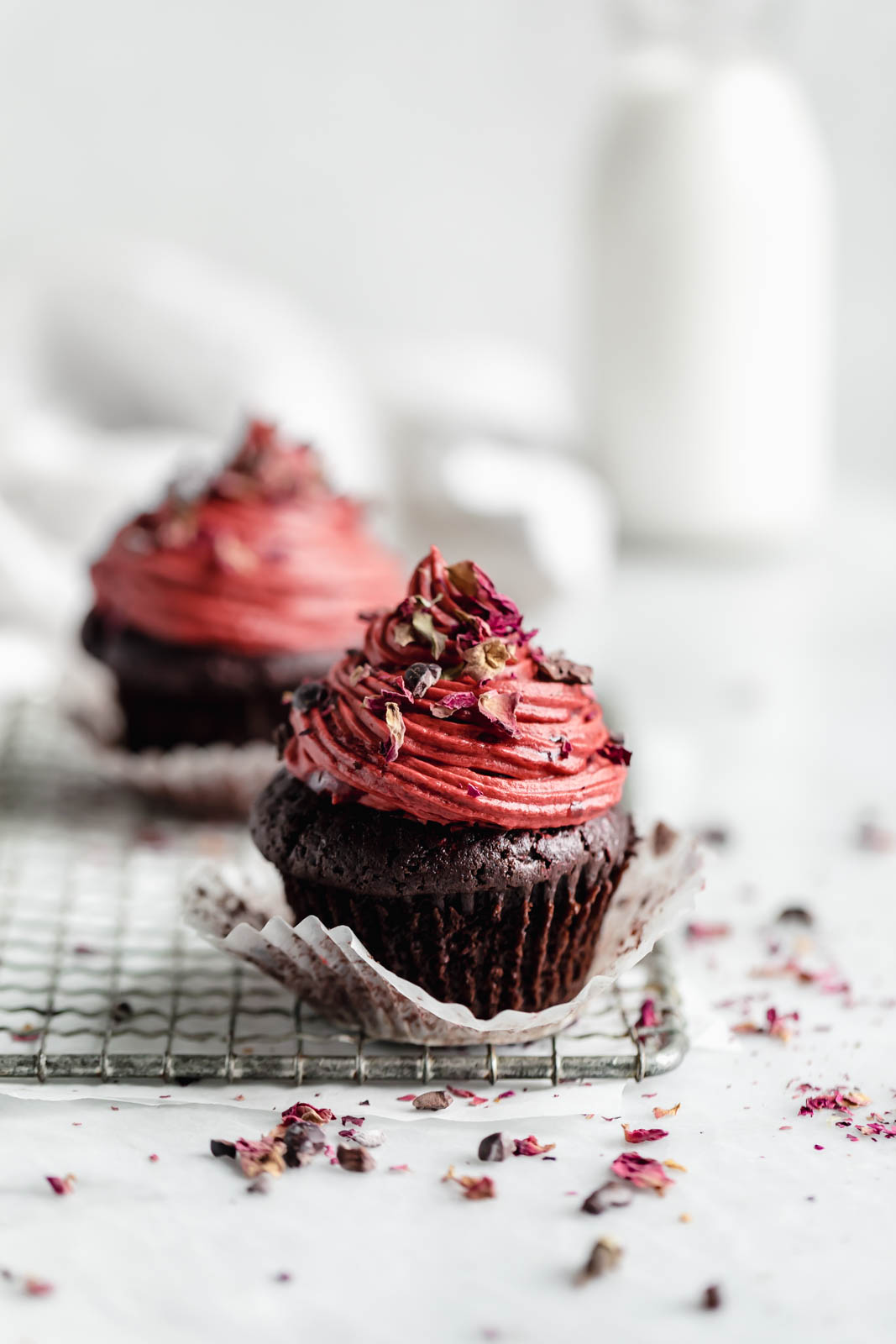 raspberry rose chocolate cupcakes on a wire rack