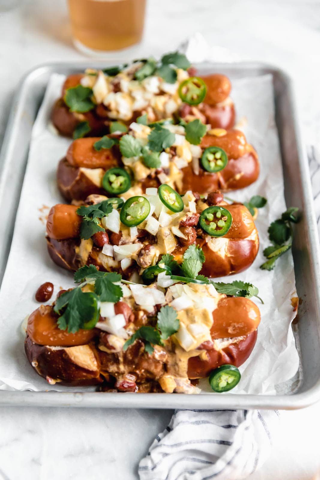 Vegan Chili Cheese Dogs with a creamy cashew queso so good even the most discerning meat-eaters will be impressed.