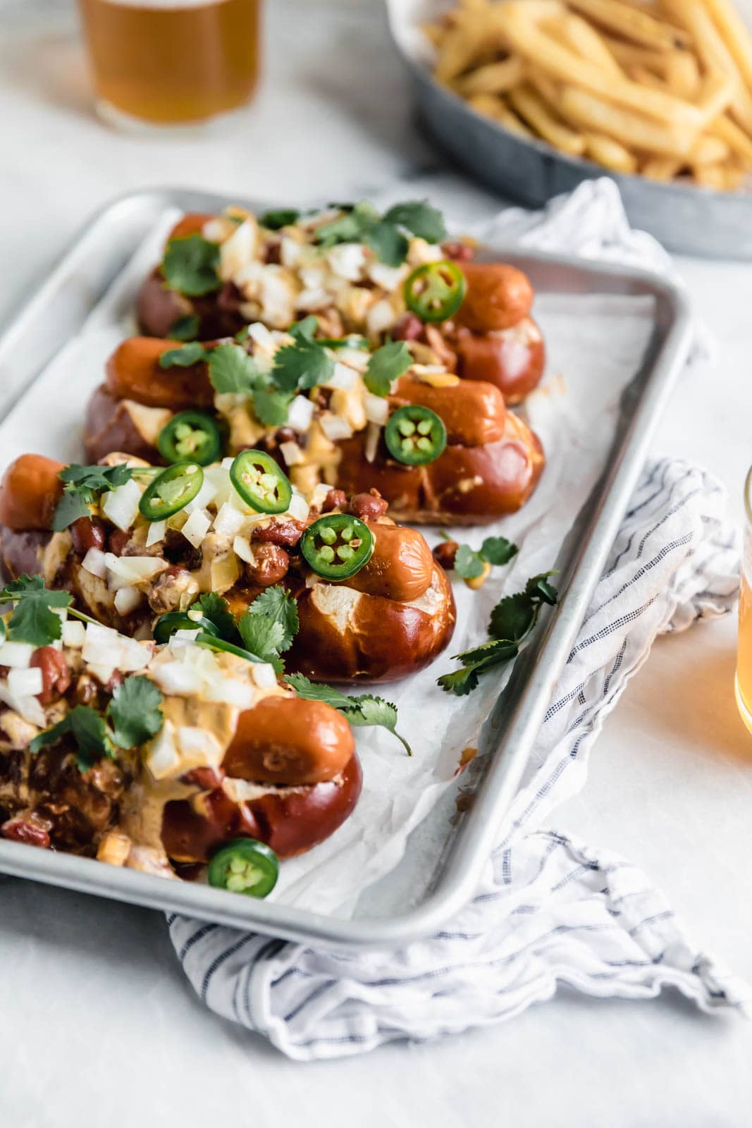 Vegan Chili Cheese Dogs with a creamy cashew queso so good even the most discerning meat-eaters will be impressed.