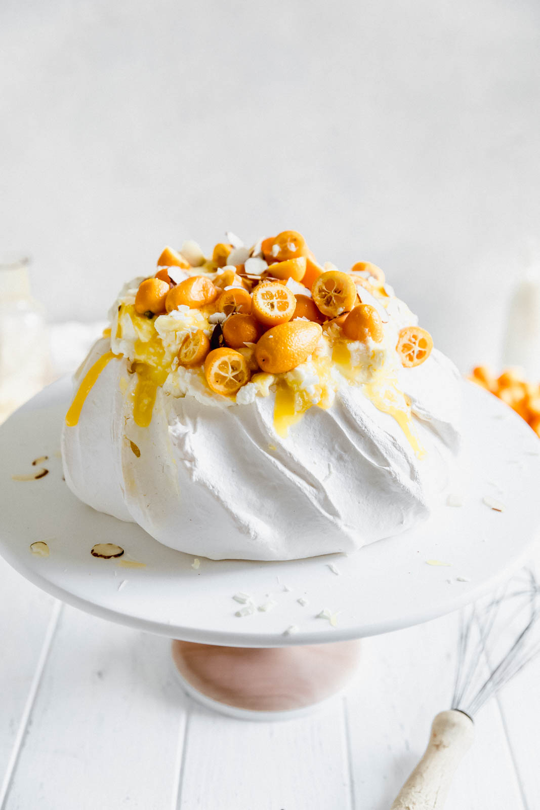 Make everyone say HUBBA HUBBA with this showstopping white chocolate and lemon curd pavlova topped with baby kumquats and sliced almonds. 