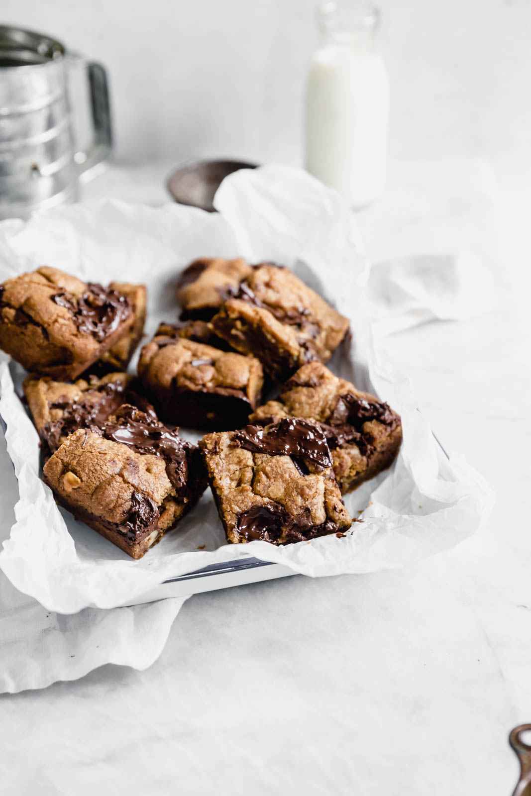 Brown Butter Nutella Chocolate Chip Cookie Bars with fat swirls of Nutella and lightly toasted hazelnuts.