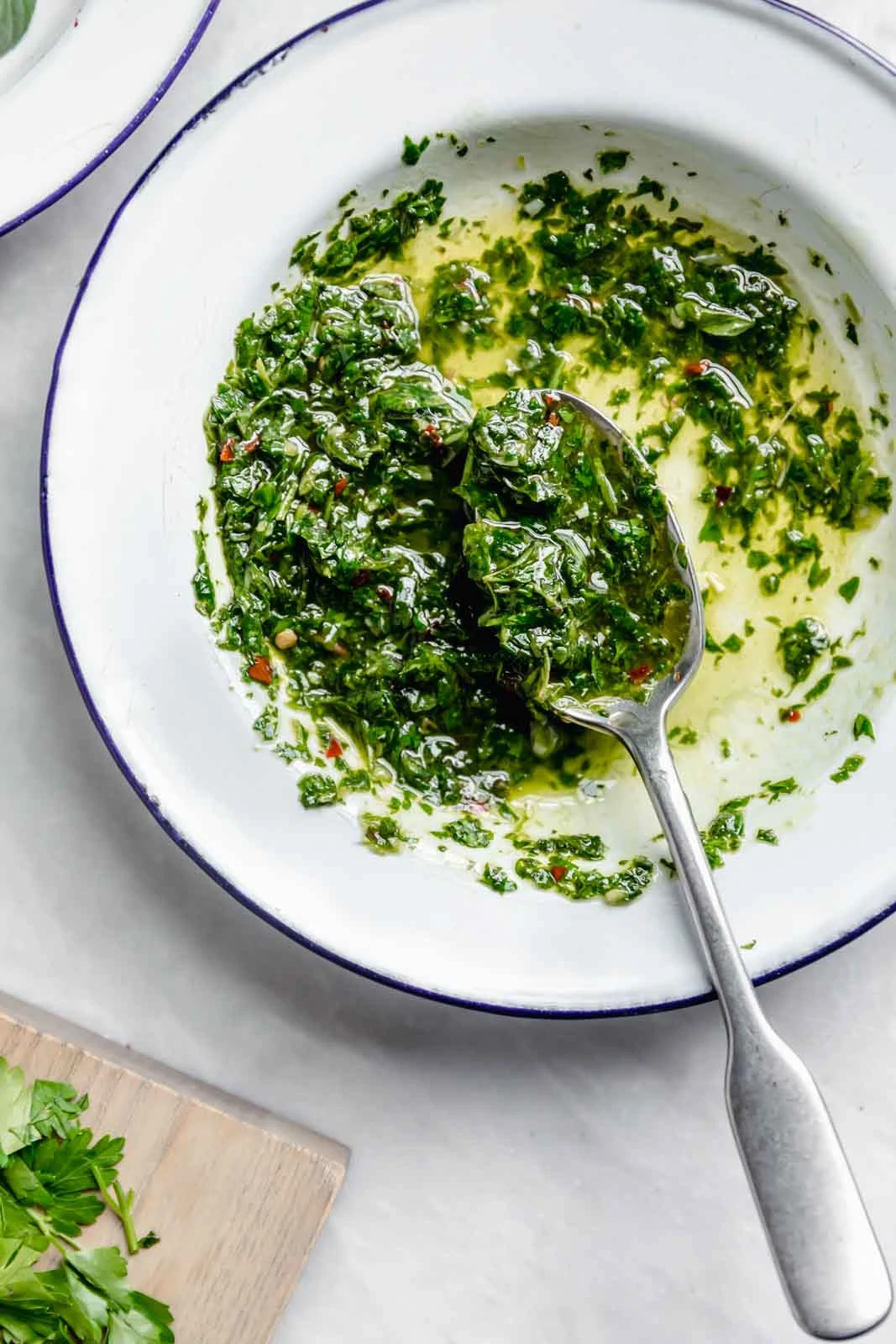 The BEST Chimichurri recipe made with all the traditional ingredients plus cilantro, lime & honey. Not to toot my own horn, but this green chimichurri is damn good.