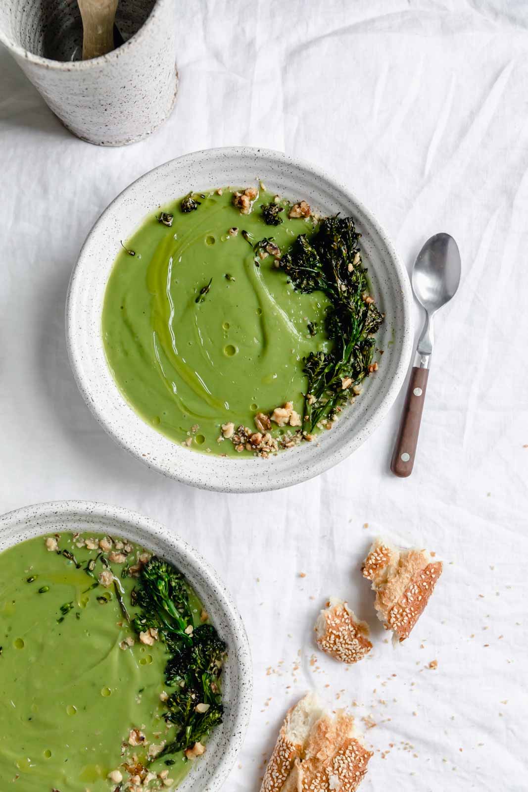 broccoli soup topped with roasted broccoli and walnuts
