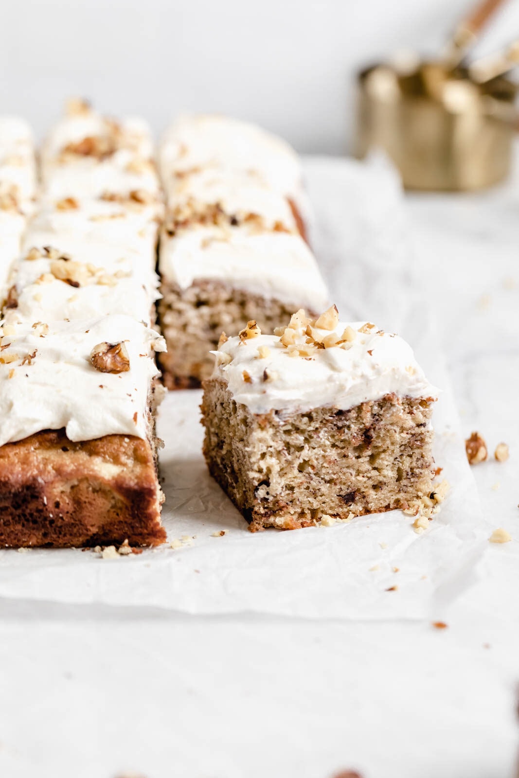 Brown butter banana chocolate chip sheet cake with cream cheese frosting has us drooling.Yum.