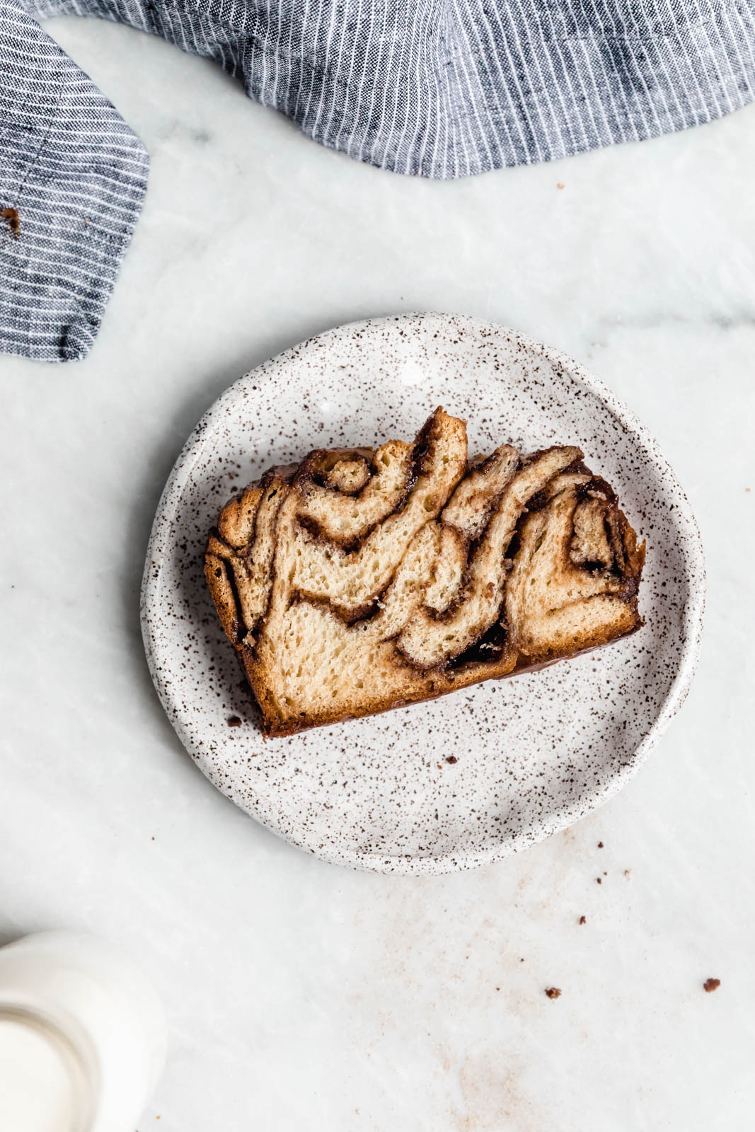Buttery, flaky dough swirled together with cinnamon AND chocolate make this stunning Cinnamon Chocolate Babka. Step by step instructions on how to make the perfect babka!