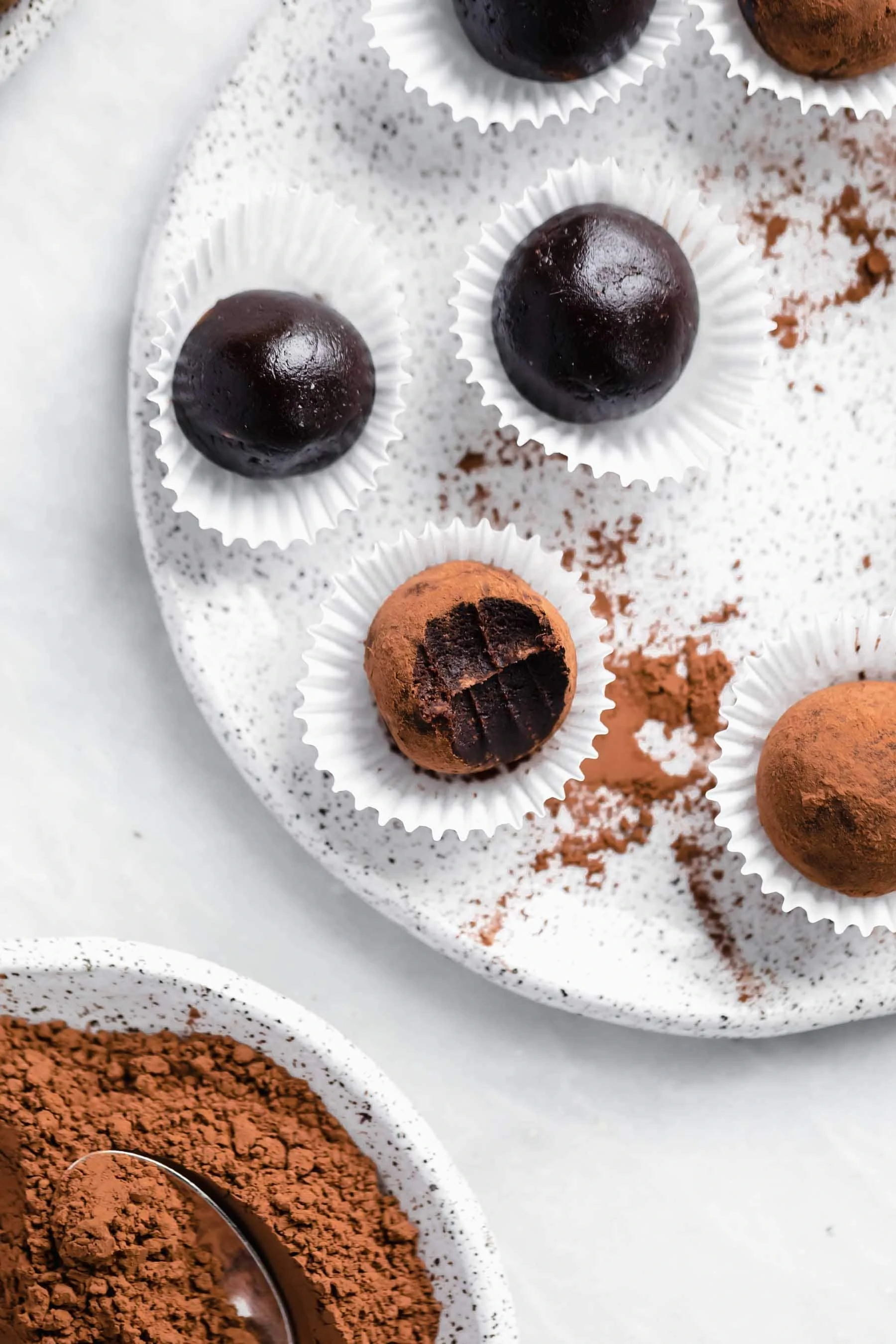 You'd never know these fudgy healthy vegan brownies truffles are raw, refined sugar free, AND gluten free. They're a chocolate lovers dream.