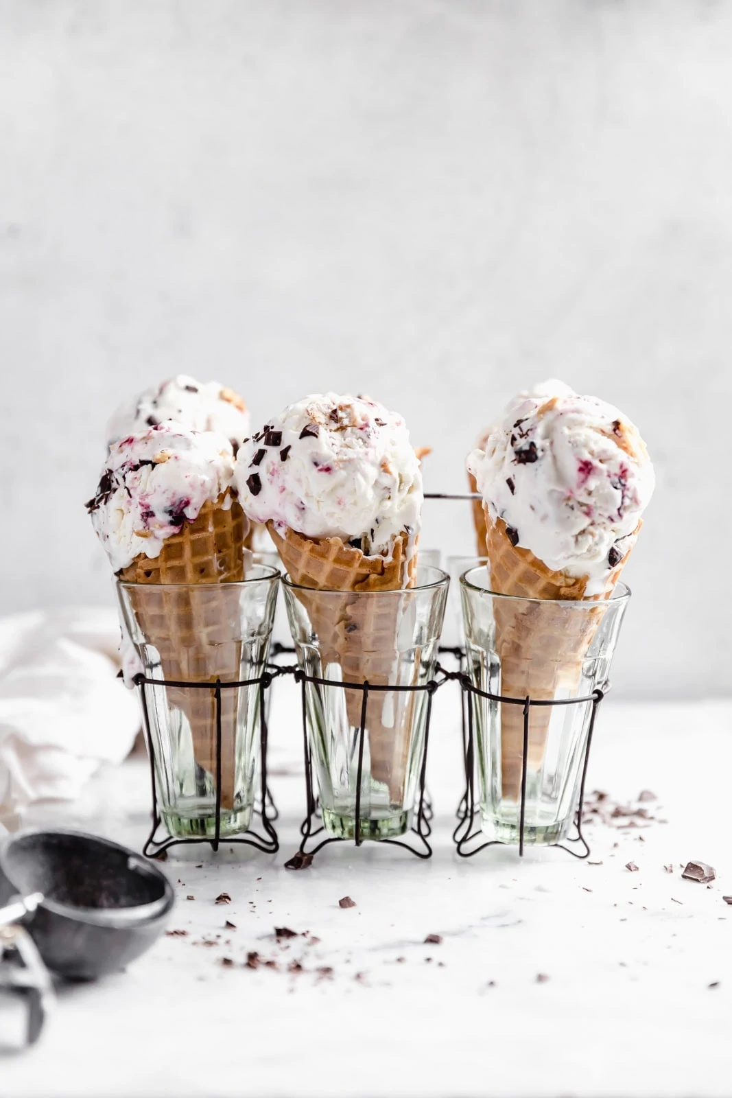 This creamy vanilla ice cream with fat blackberry swirls, buttery waffle pieces, and chocolate chips has us in heaven. Whip up this no churn blackberry waffle chocolate chip ice cream in minutes and skip the line at the ice cream shop.
