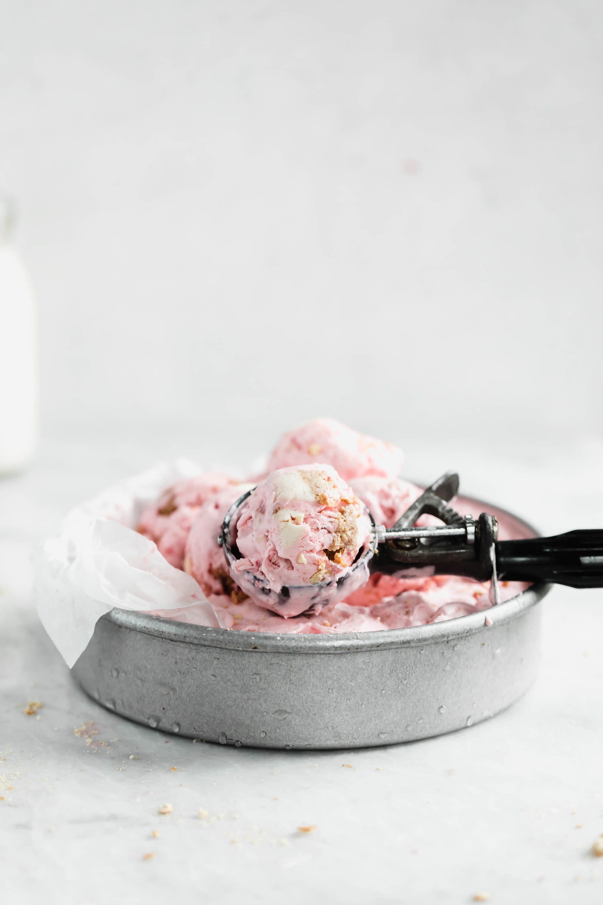 Kick off ice cream season with this easy and delicious no churn strawberry cheesecake ice cream. Creamy strawberry ice cream mixed with chunks of cheesecake. YUM.